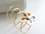 I wear a Flower Around my Finger, 14 k gold, red, yellow, orange, purple resin by Stilosissima, California